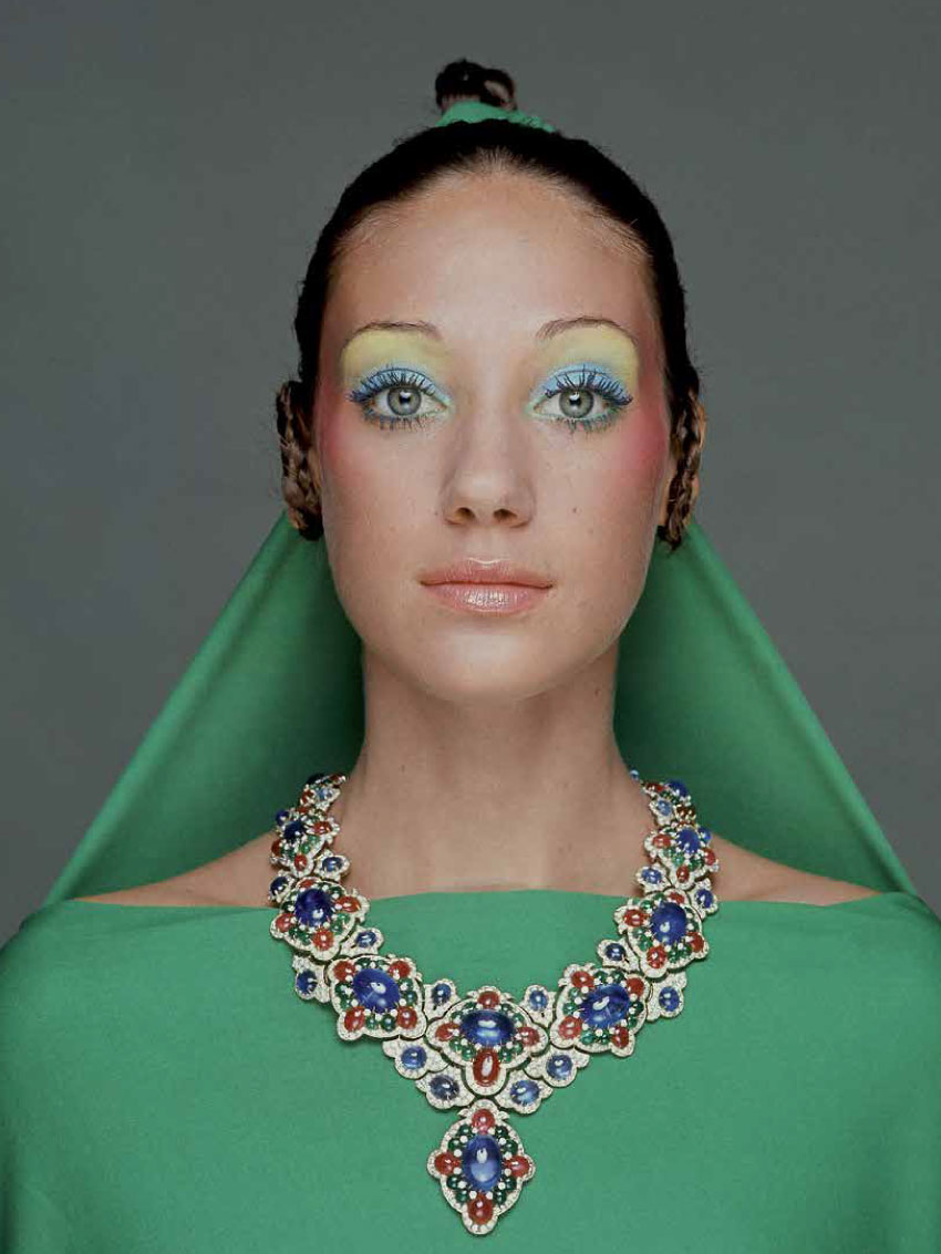 Vogue 1970 Model, Marisa Berenson wearing a green drape and matching hair veil tied from her topknot hairstyle, with a necklace of gold, diamonds, rubies and emeralds by Bulgari; make-up by Alexandre de Markoff.